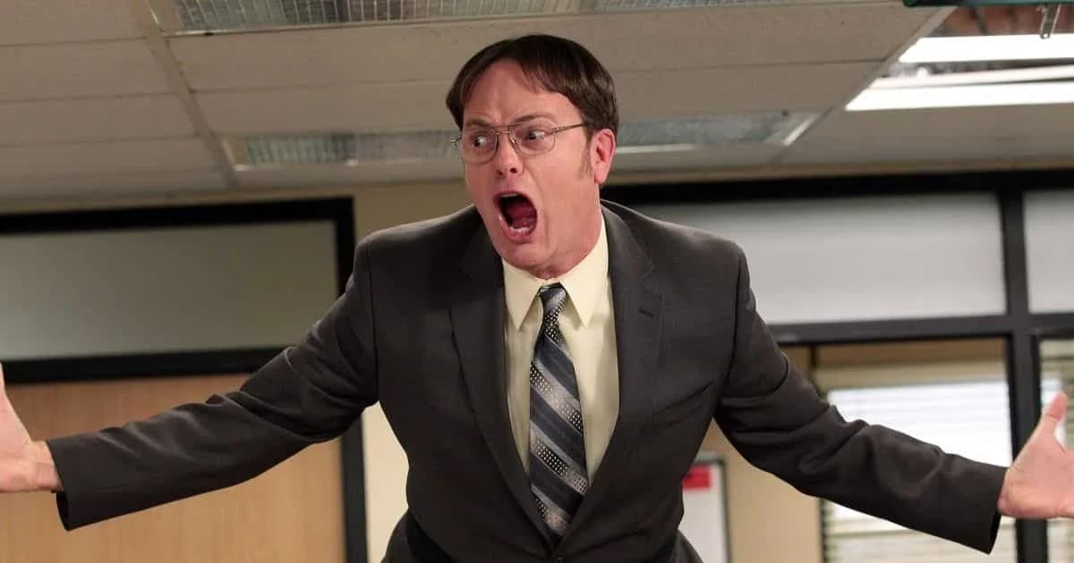 Dwight Schrute shouting during an office meeting